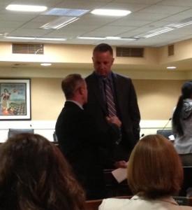 Senator Anthony Cannella confers with the head of the State Building Trades before August 14, 2013 hearing on Senate Bill 7